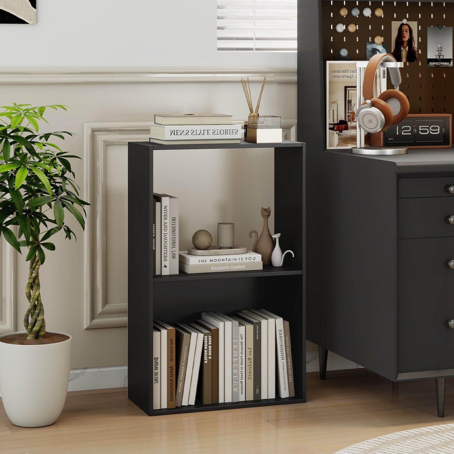 Black 3-tier bookshelf with open storage compartment and freestanding display shelf for home office organization.