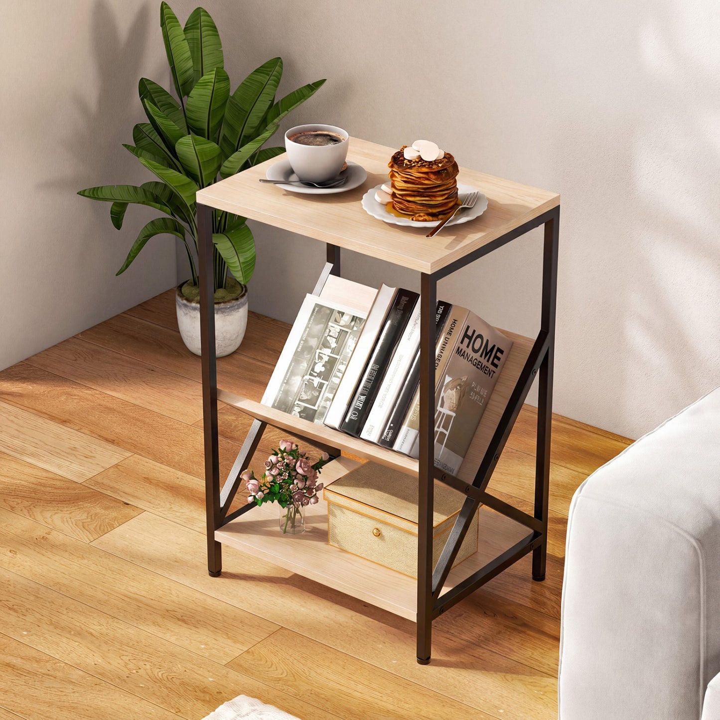 Three-tier industrial side table with V-shaped bookshelf in natural wood finish, perfect for living room decor.