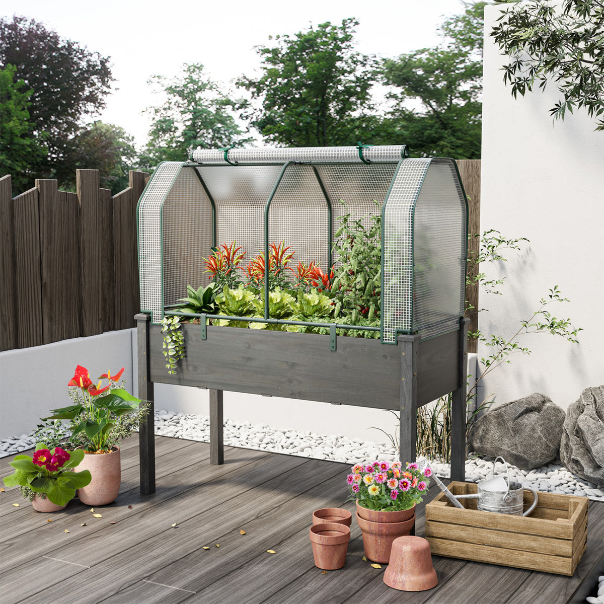 Outdoor portable mini greenhouse with green PE cover, zippered door, ideal for vegetables, by Direct by Wilsons Home Store.