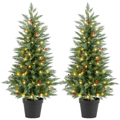 Pair of 4 ft pre-lit Christmas trees with 70 warm white LED lights and 173 branch tips, ideal holiday decor by Wilsons Home Store.