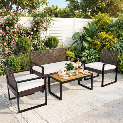 4-piece patio set with acacia coffee table and wicker chairs in brown and black, outdoor patio furniture for backyard relaxation