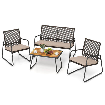 Four-piece patio furniture set with acacia wood coffee table and zippered cushions, outdoor patio furniture by Wilsons Home Store.