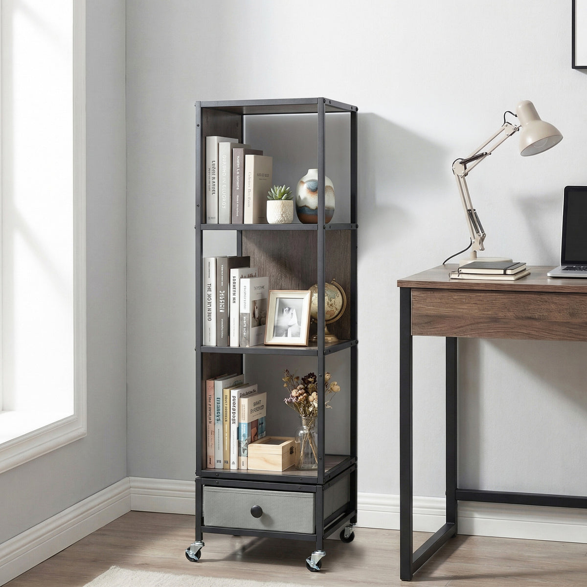 Gray 4-tier rotating bookshelf on wheels with removable drawer, ideal for home office storage by Wilsons Home Store.