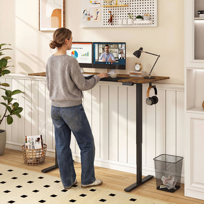 Height adjustable 63x24 inch computer desk with three memory presets, natural finish, from Wilsons Home Store.
