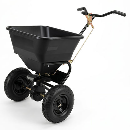 Walk-behind broadcast spreader with 66 lbs capacity, black color, 13-inch all-terrain tires, ideal for lawn and garden fertilizing.