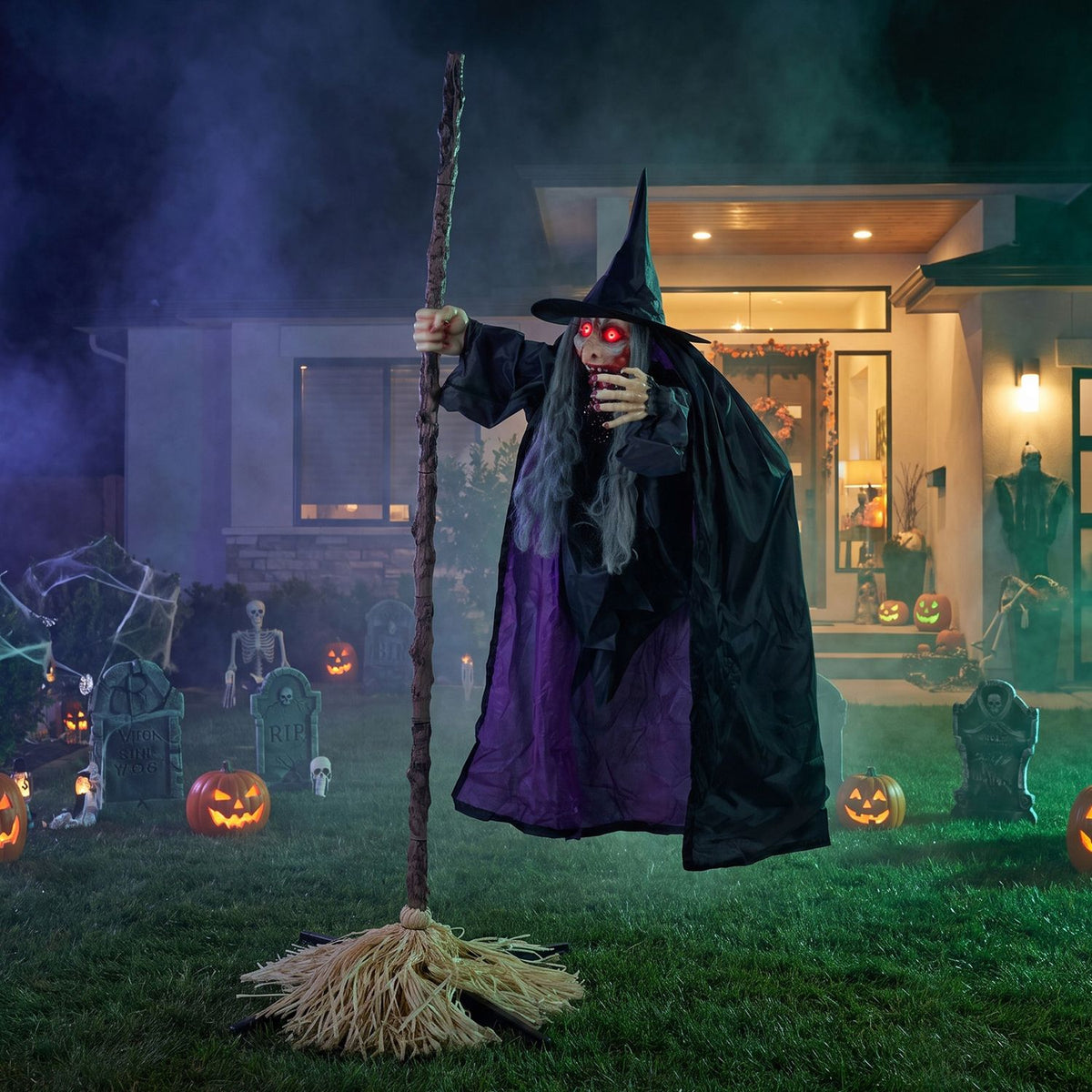 6.6FT Halloween animated flying witch on broom decoration with moving wings and waving arms for spooky holiday decor.