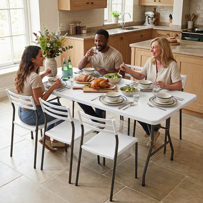 White 6 ft plastic fold-in-half camping table by Wilsons Home Store, ideal for outdoor picnics and patio gatherings.