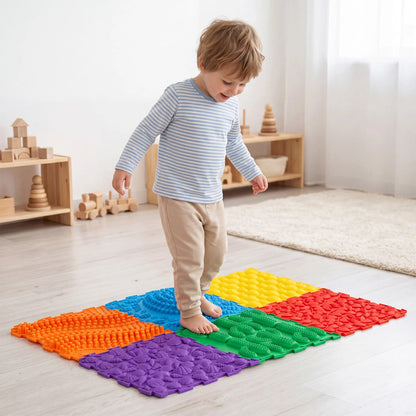 Six colorful interlocking sensory mats for kids and adults, perfect for play areas and gyms, by Wilsons Home Store.