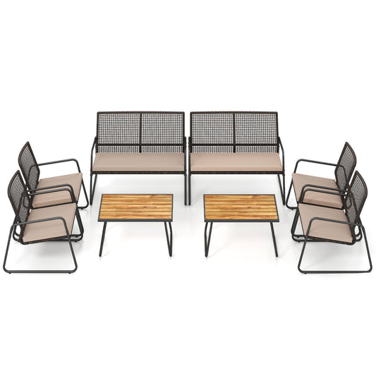 Eight-piece outdoor patio furniture set with acacia wood coffee table and yellow zippered cushions, perfect for outdoor seating.