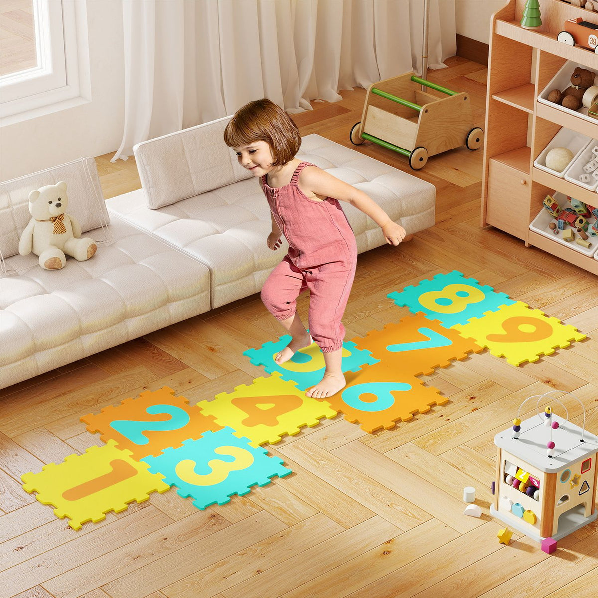 Nine-piece interlocking foam puzzle floor mat with three marker discs, designed for baby and kids play areas.