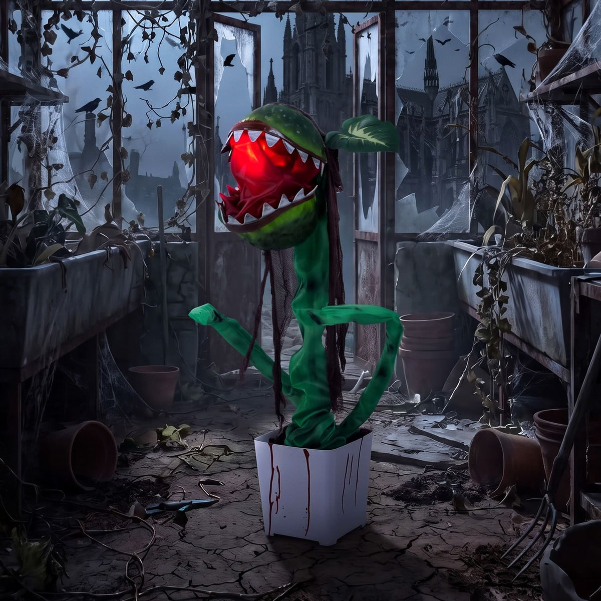 Animated Halloween Man-Eater Plant prop with moving jaws, green leaves, and spooky decoration for Halloween decor.