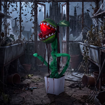 Animated Halloween Man-Eater Plant prop with moving jaws, green leaves, and spooky decoration for Halloween decor.