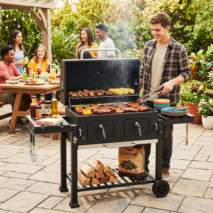 Large charcoal grill by Wilsons Home Store with lifting trays, folding tables, wheels, perfect for outdoor grilling.