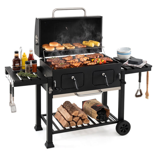 Large charcoal outdoor grill by Wilsons Home Store with lifting charcoal trays, folding tables, and wheels for easy mobility.