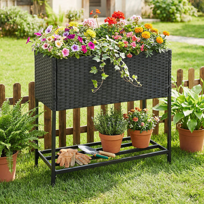 Black elevated garden planter with rattan finish bottom shelf, outdoor raised garden bed for stylish planting.