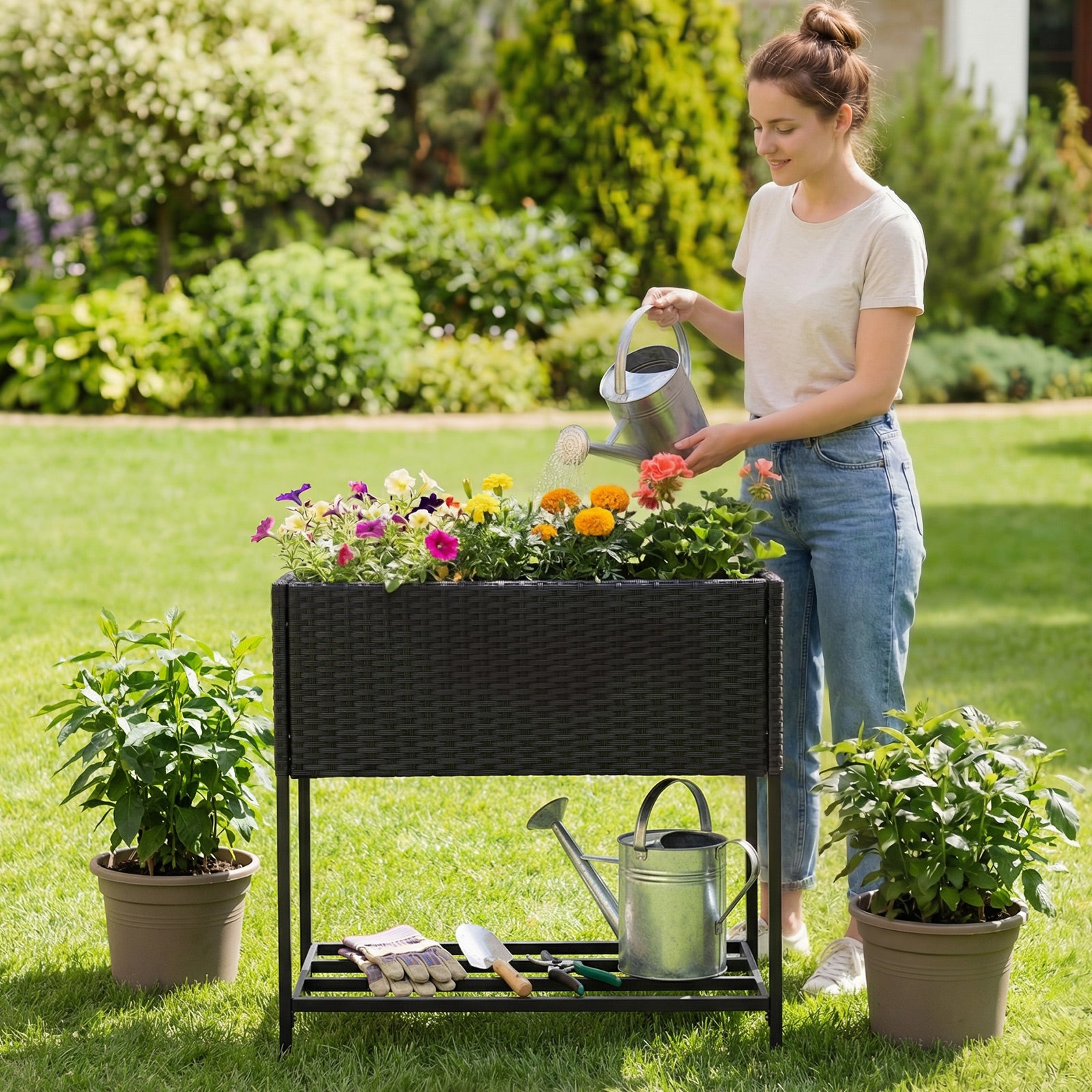 Black elevated garden planter with rattan finish bottom shelf for outdoor gardening, perfect for raised garden beds.