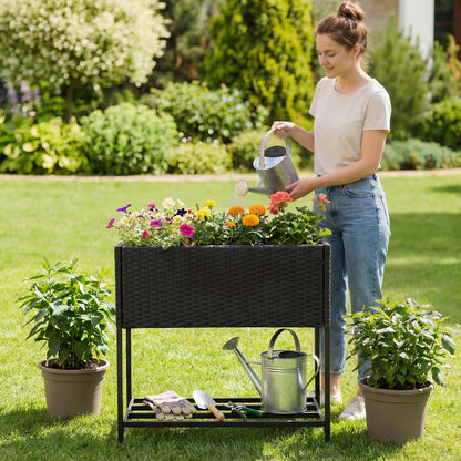 Black elevated garden planter with rattan finish bottom shelf for outdoor gardening, perfect for raised garden beds.