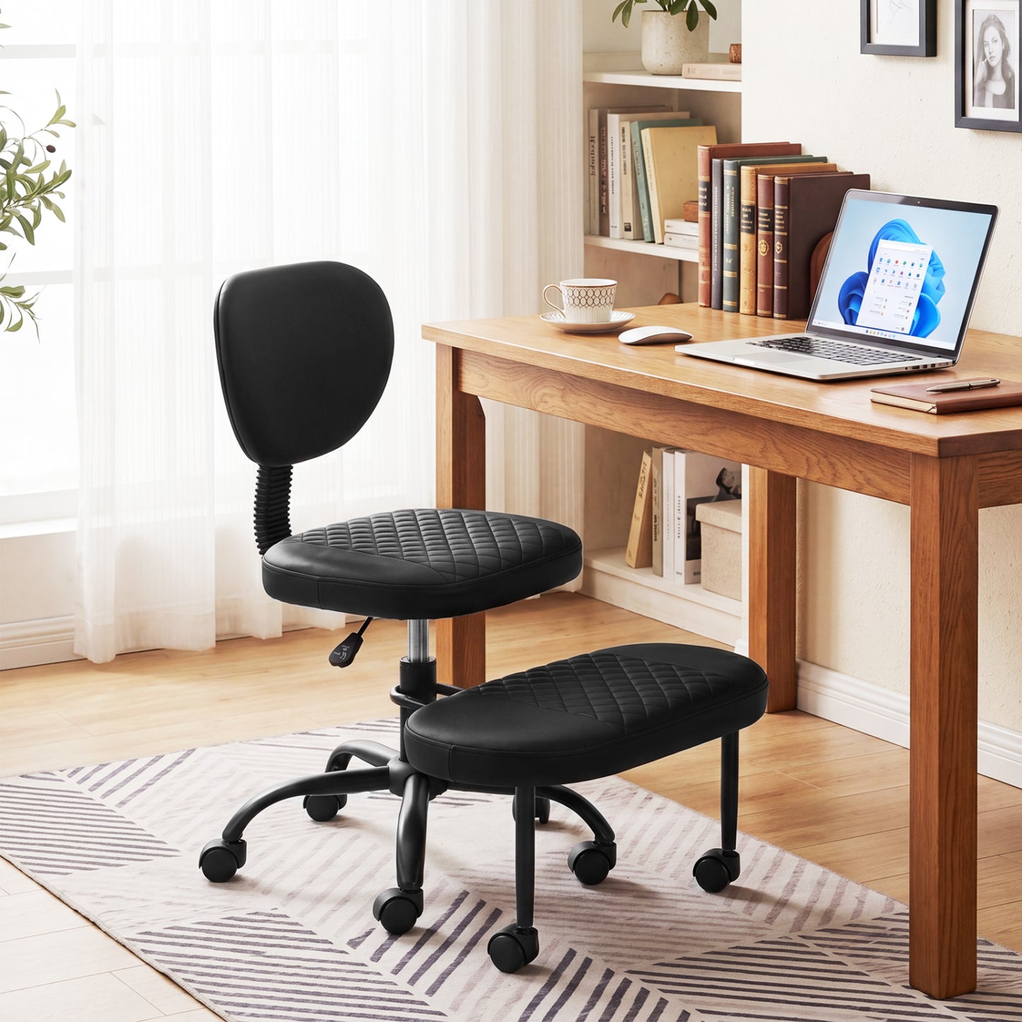 Black ergonomic cross-legged office chair with height-adjustable seat, designed for comfortable home office seating