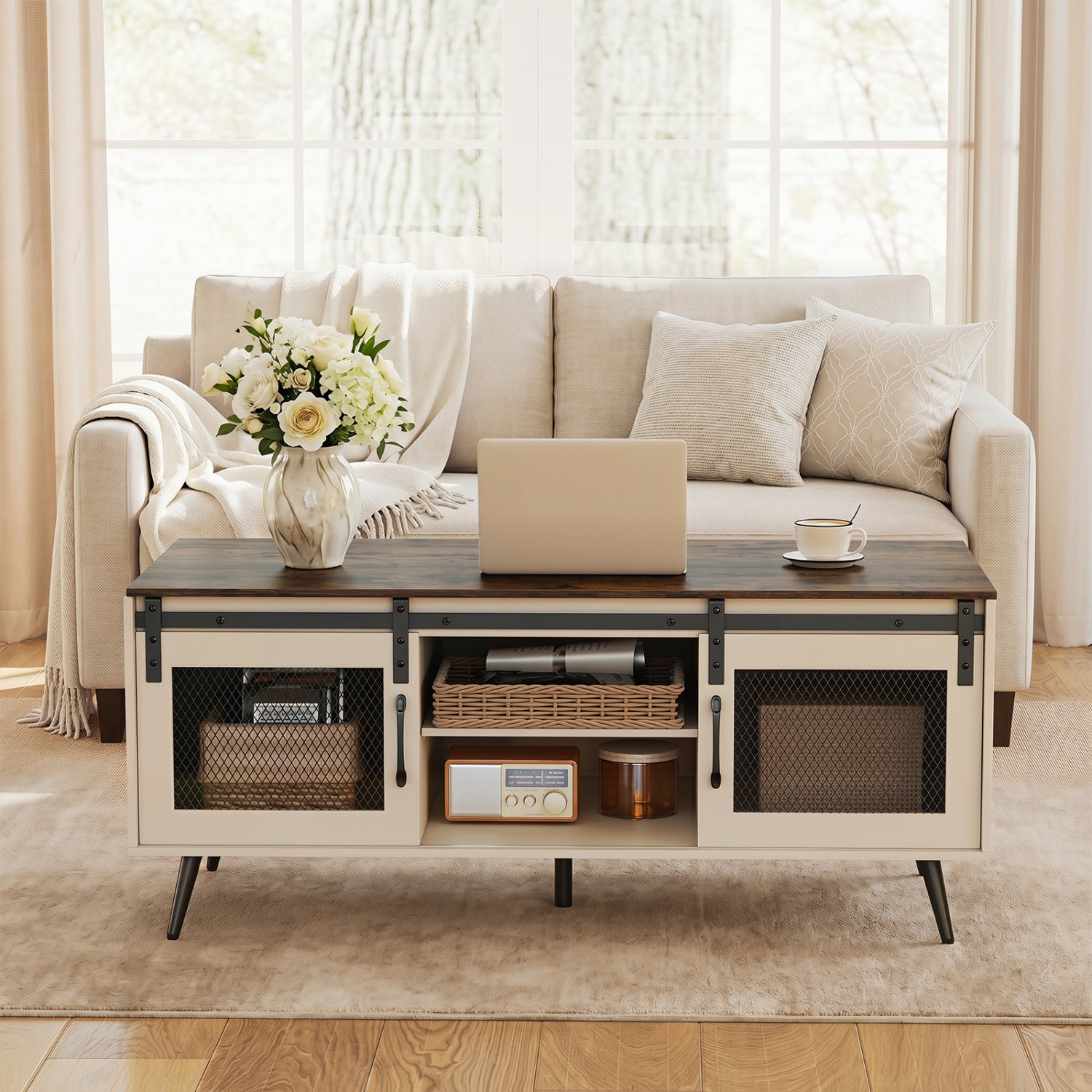 Rustic brown farmhouse coffee table with sliding doors and adjustable shelf, made of wood, in a living room setting.
