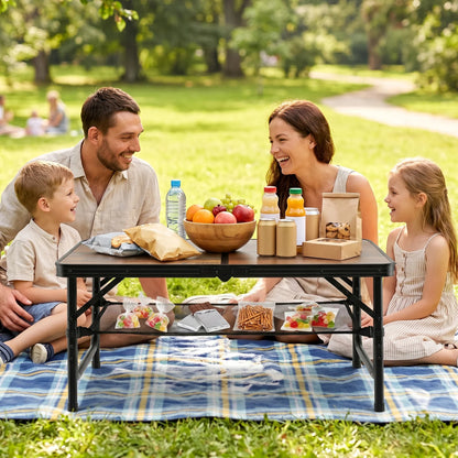 Black and brown folding camping table with adjustable height, storage net, and handle, ideal for outdoor patio and picnic use.