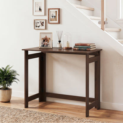 Black folding console table with foldable legs, ideal for entryway or living space, by Wilsons Home Store.