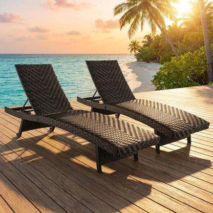 Set of two folding padded rattan patio chaise lounges with adjustable backs for outdoor seating, designed for comfort and style.