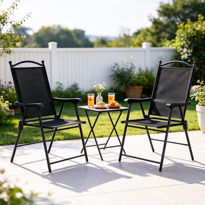 Set of four black folding patio chairs with high backs and armrests, ideal for outdoor lawn and deck seating.