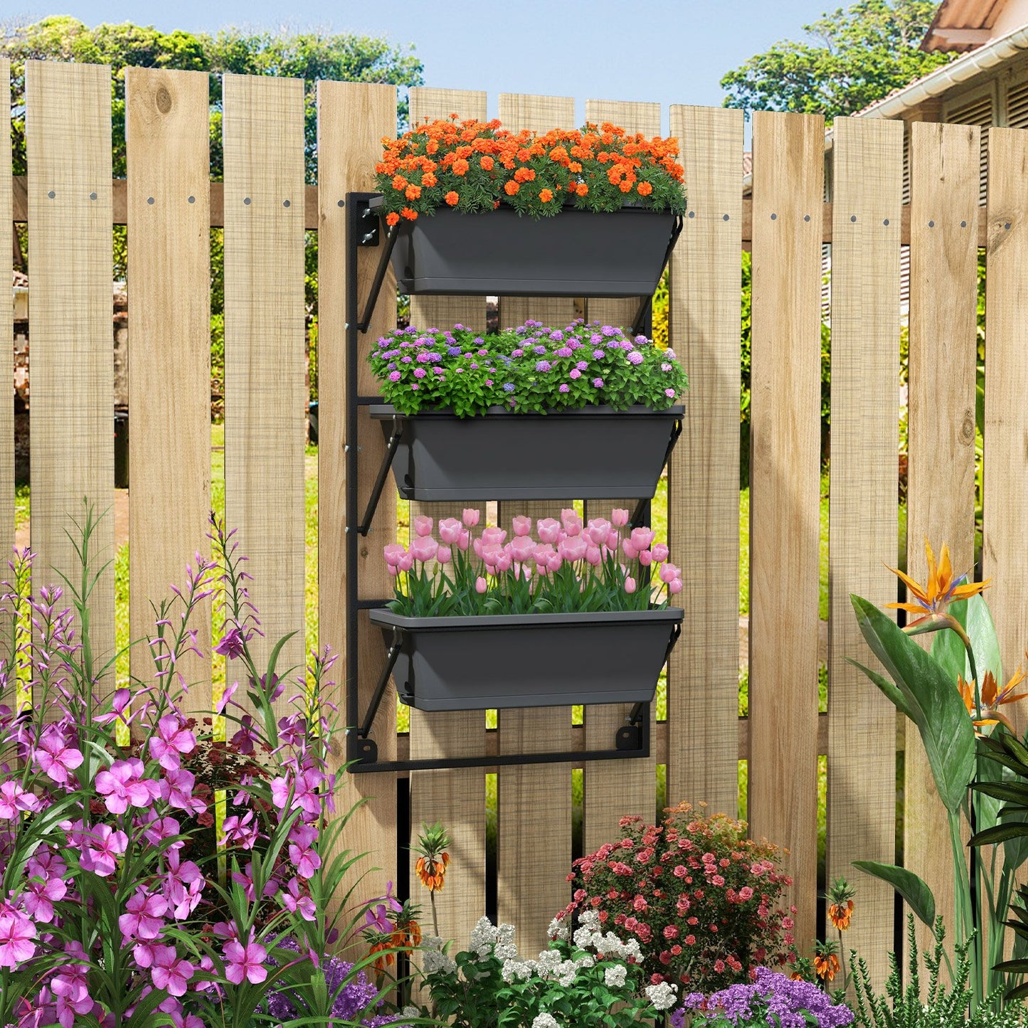 Black hanging vertical planter with adjustable height and detachable hooks, ideal for outdoor garden wall mounting.