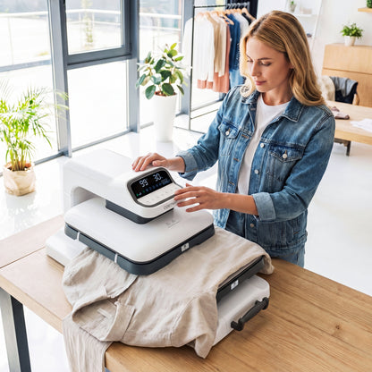Blue heat press machine with auto release for T-shirts, ideal for customizing apparel, by Wilsons Home Store.