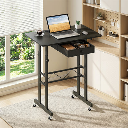 Black height adjustable laptop desk with fabric drawer, tablet holder, and lockable wheels, suitable for home office use.