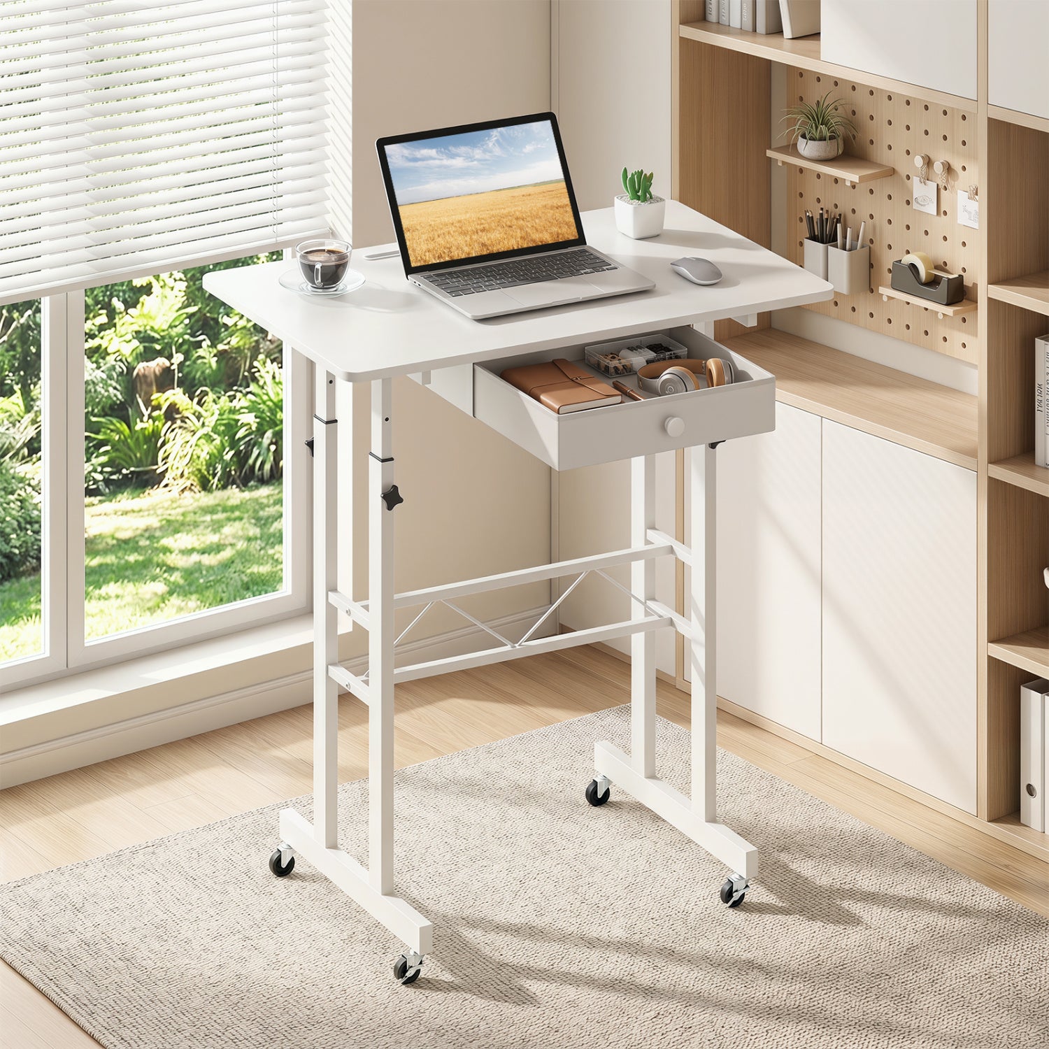 Black height adjustable laptop desk with fabric drawer, tablet holder, and lockable wheels for versatile home office use.
