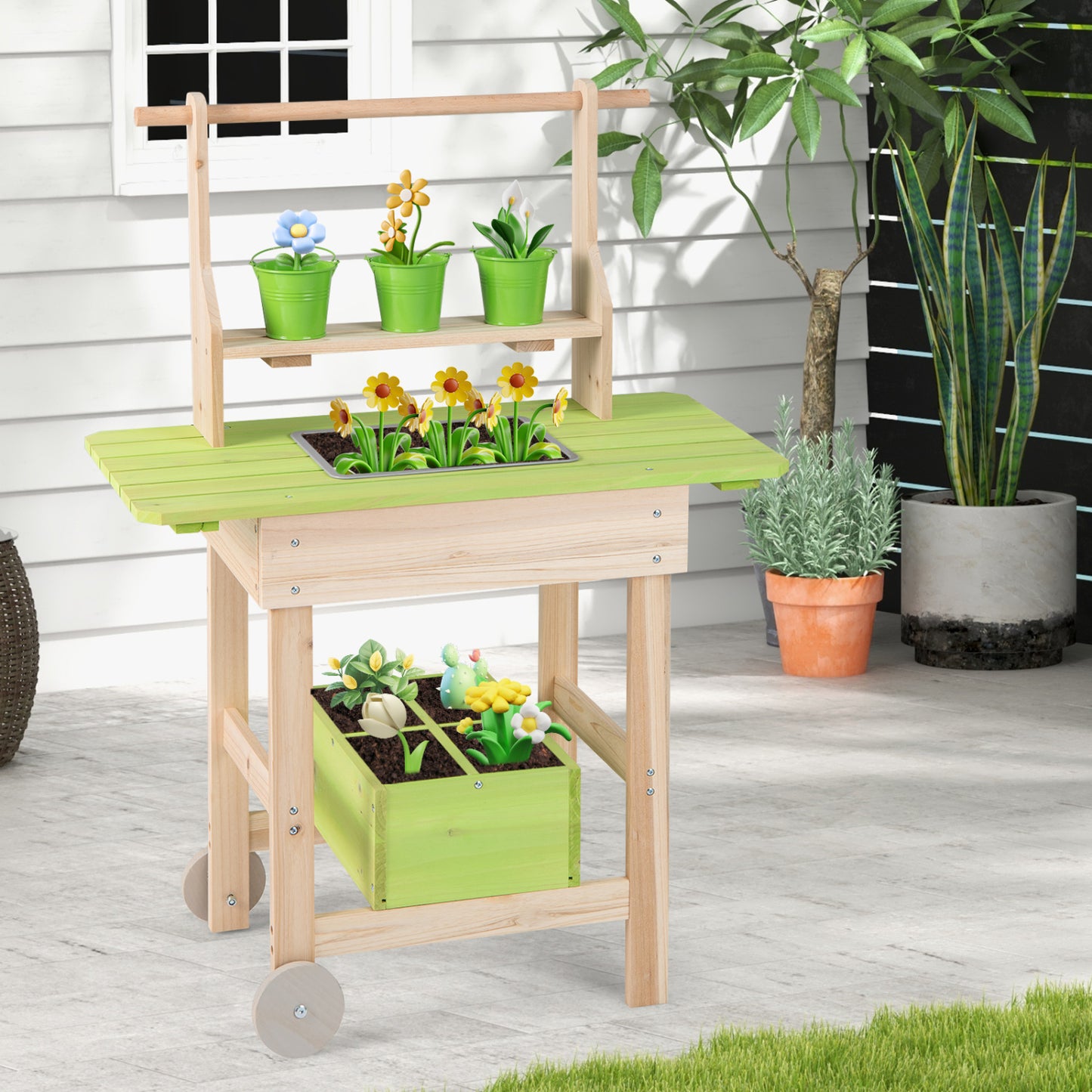 Kids mud kitchen with removable pots, watering can, planting trough, and storage box for outdoor pretend play.