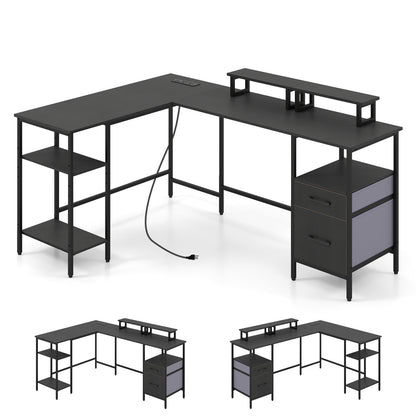 Black L-shaped desk with built-in power outlet and monitor stands, ideal for home office use, by Direct by Wilsons Home Store.