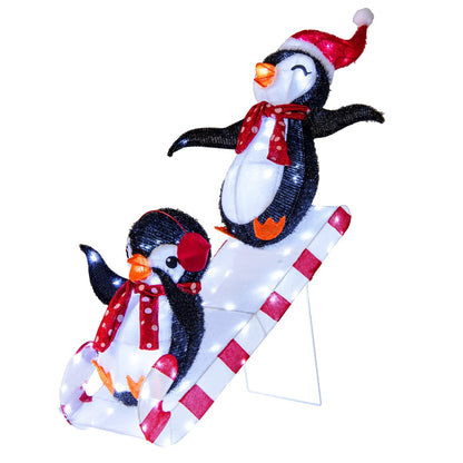 Lighted 3D Christmas penguin decoration with 170 LED lights, pre-lit holiday decor featuring festive penguin slide scene.