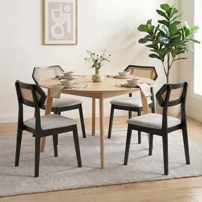 Set of two mid-century rattan dining chairs with rattan backrests and solid wood frames, black finish, by Wilsons Home Store.