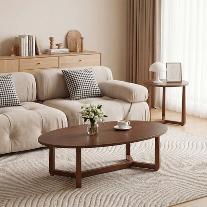 Pair of nesting coffee tables with wood veneered tops and solid rubber wood legs in a natural finish, ideal for living room decor.