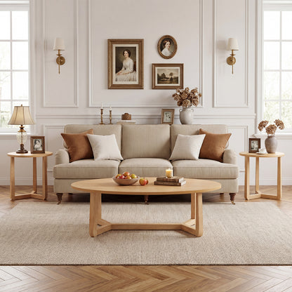Set of three nesting coffee tables with wood veneer tops and solid rubber wood legs for a living room setting.