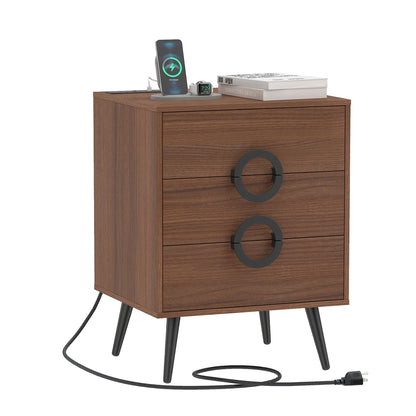 Black modern nightstand with 3 drawers, power outlets, and cable hole for bedroom use by Wilsons Home Store.