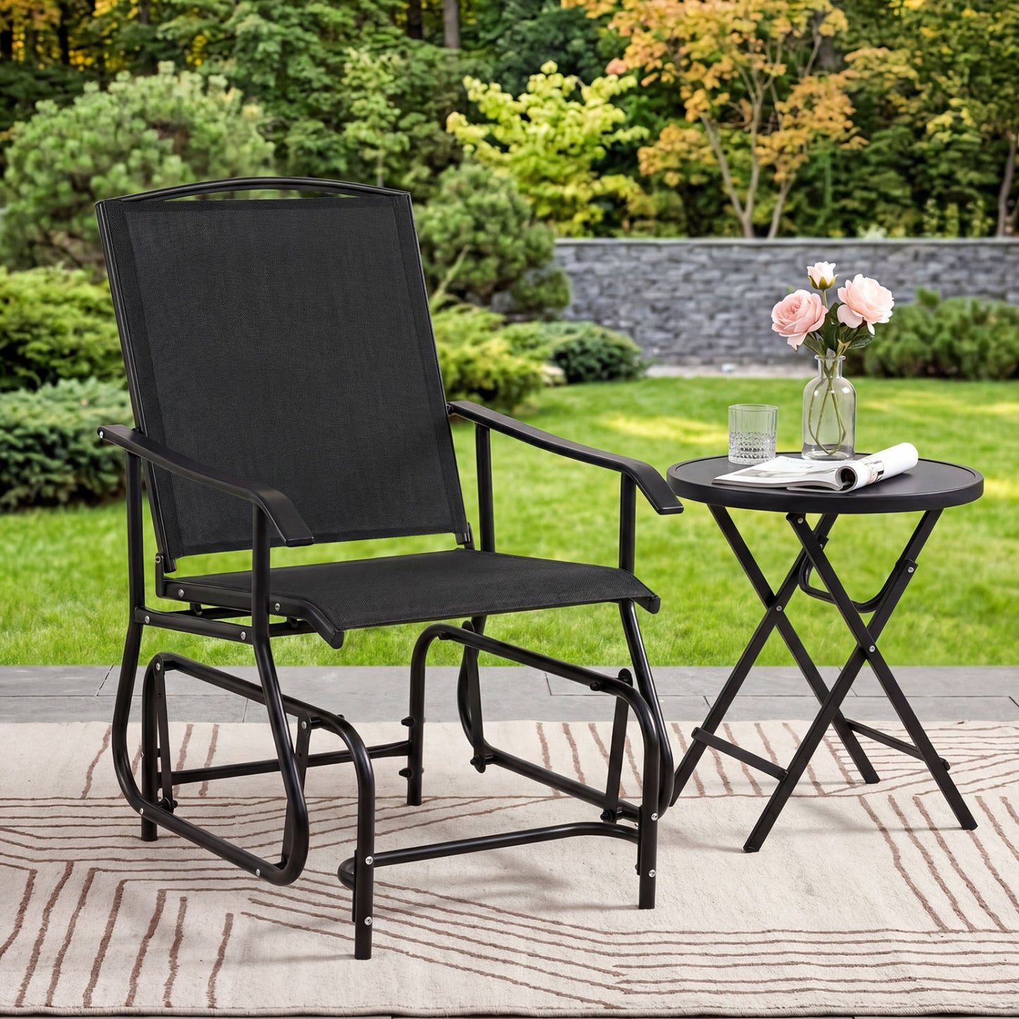 Black outdoor glider chair with metal frame and armrests, ideal for patio seating and outdoor relaxation.