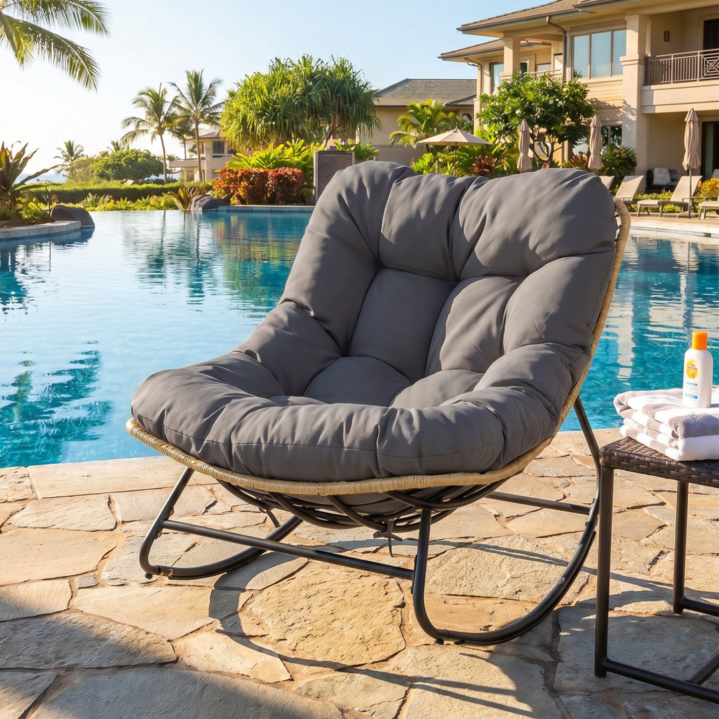 Gray outdoor papasan rocking chair with thick cushioned seat for patio relaxation, designed for outdoor patio and garden use.