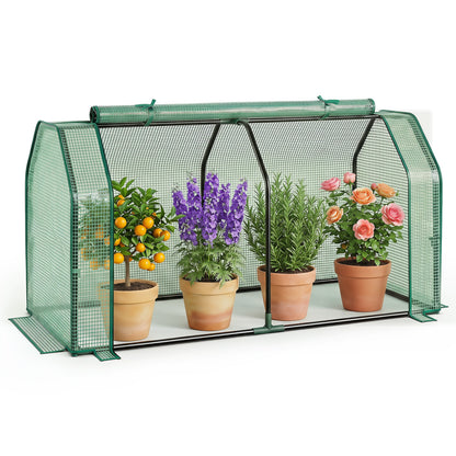 Portable green greenhouse with PE cover and zippered door for vegetables, ideal for outdoor garden use.