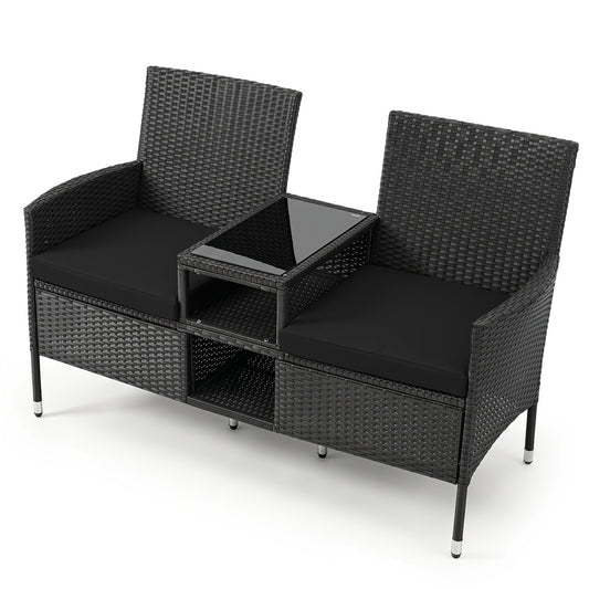 Black outdoor wicker patio loveseat with built-in glass side table, part of a patio conversation set by Wilsons Home Store.