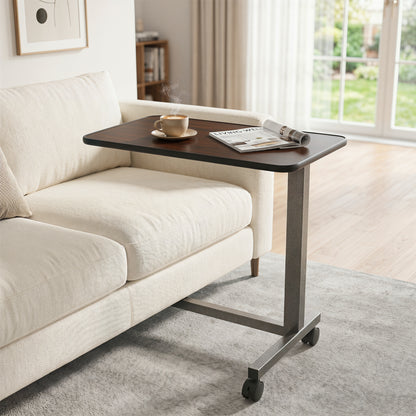 Walnut overbed table with lockable wheels and H-shaped base, suitable for hospital or home use, by Wilsons Home Store.