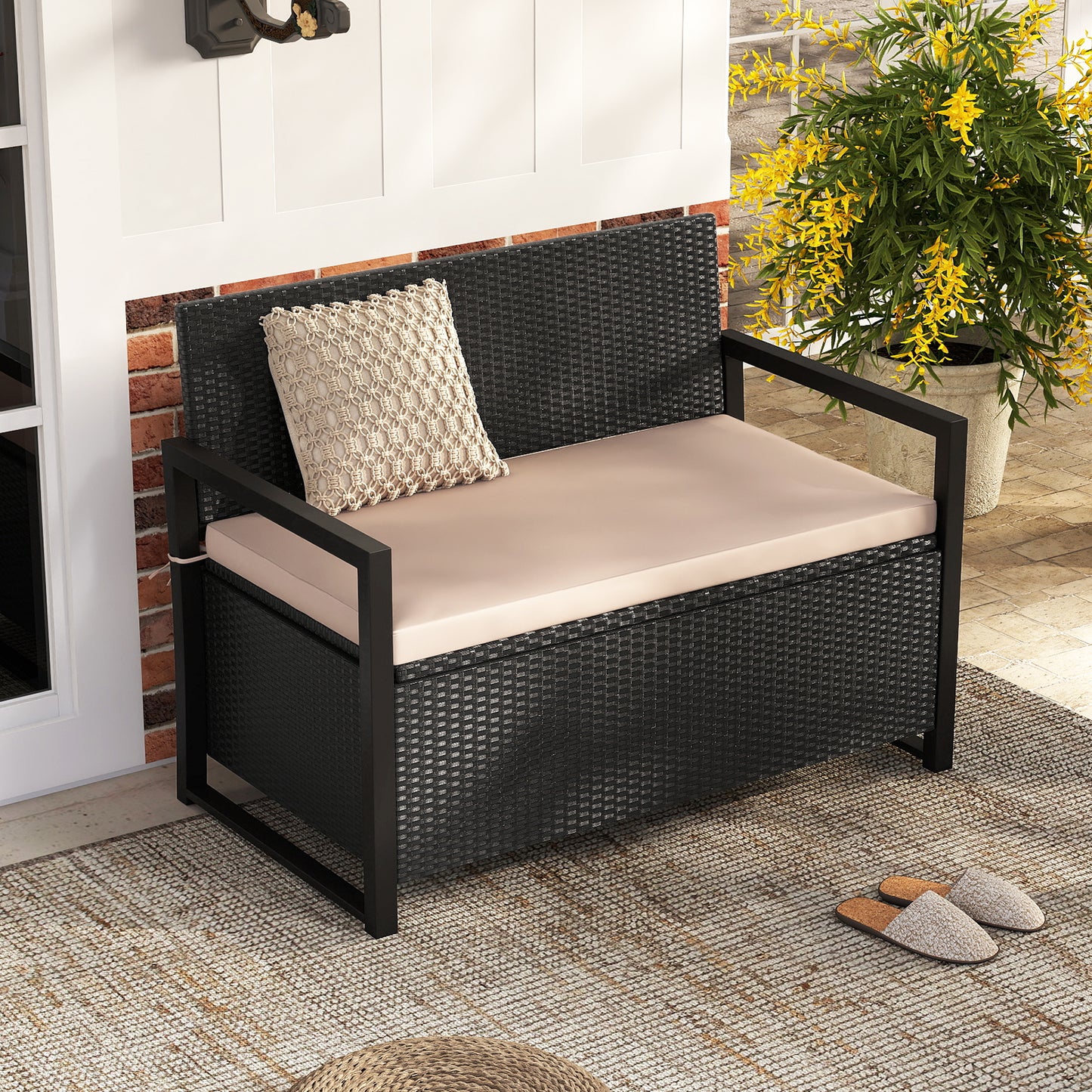 Outdoor wicker patio storage bench with built-in storage and loveseat design, by Wilsons Home Store.