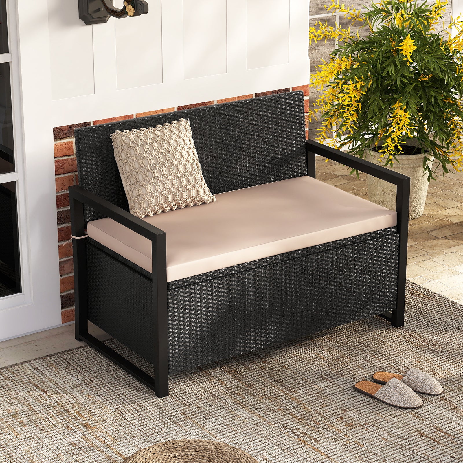 Outdoor wicker patio storage bench with built-in storage and loveseat design, by Wilsons Home Store.