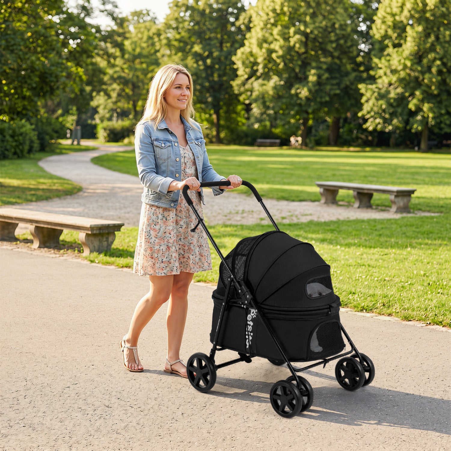 Foldable black pet stroller for small and medium dogs with canopy and one-step rear brake, designed for easy transport.