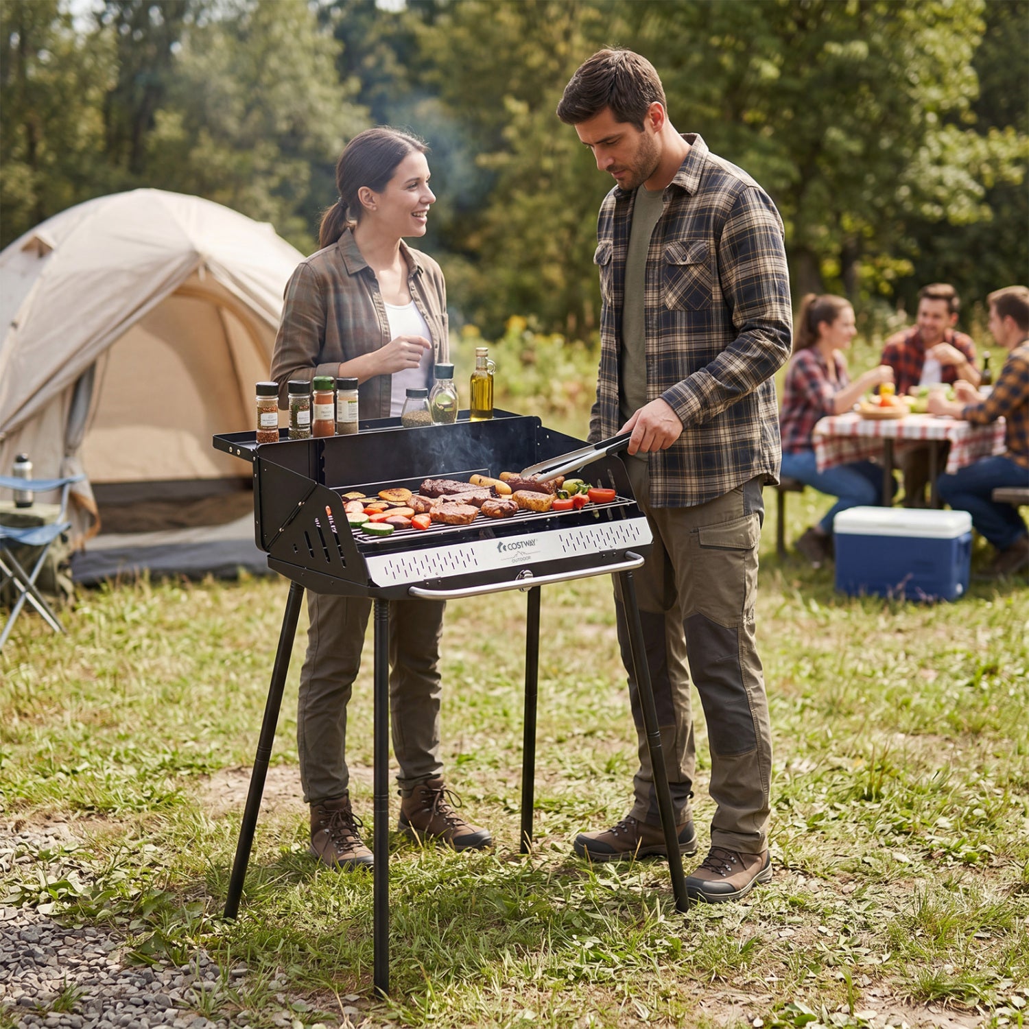 Portable charcoal grill from Wilsons Home Store with detachable legs, adjustable grate, and carrying bag for outdoor grilling.