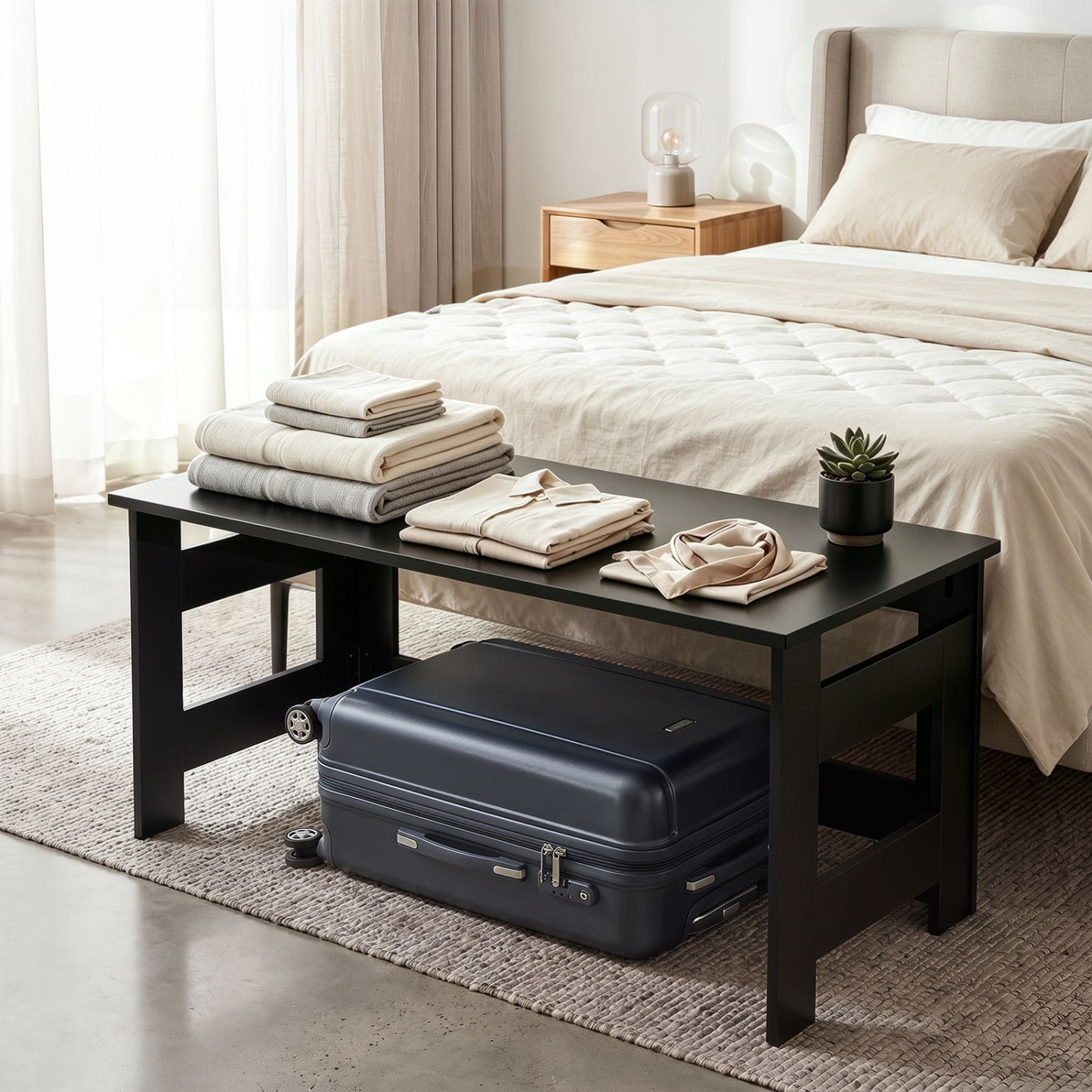 Black portable low floor coffee table with foldable legs, ideal for living room use, by Direct by Wilsons Home Store.