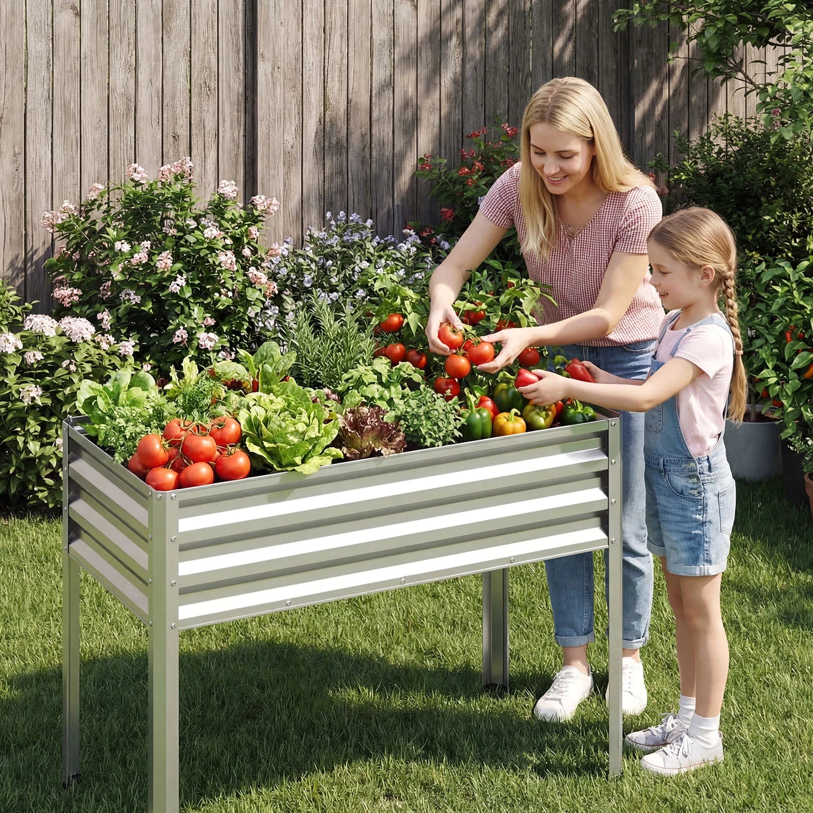 Large black raised garden bed with metal legs, electro-coated for outdoor use, ideal for elevated planting in gardens.