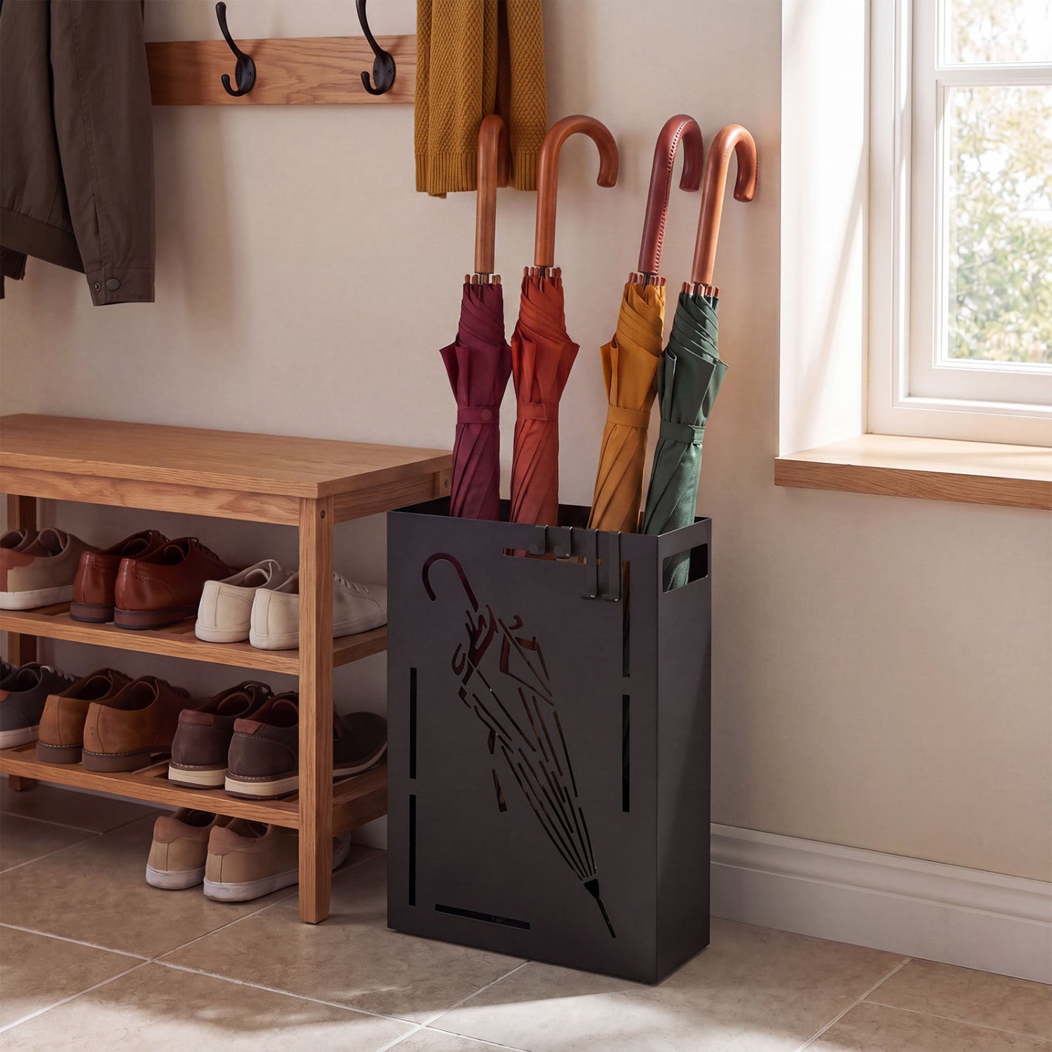 Black rectangular umbrella holder rack with removable drip tray, perfect for entryway shoe storage and organization.